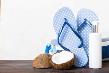 Top view composition of flip flops placed with beach accessories perspective view on table...