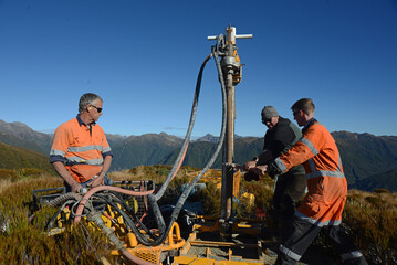 drilling a hole on the summit