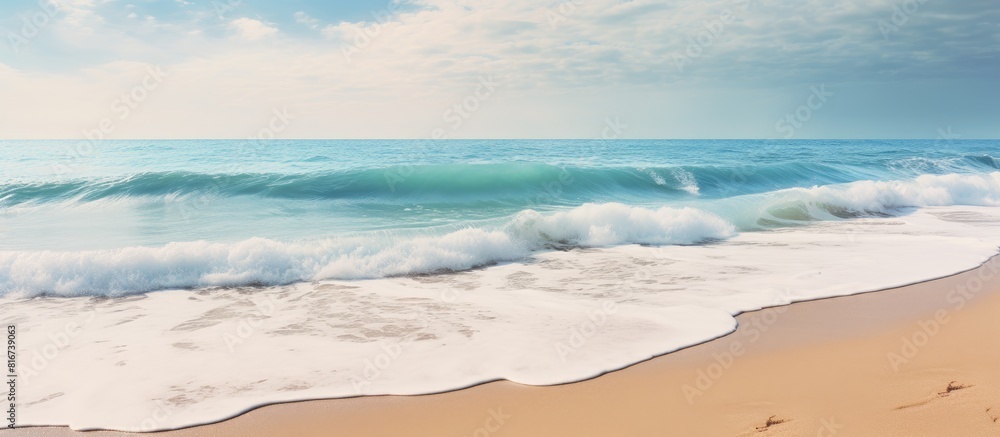Poster A serene seaside scene with frothy waves crashing onto the sandy beach creating a tranquil atmosphere for a calming vacation Copy space image