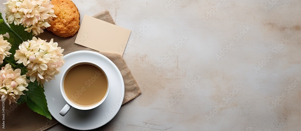 Poster top view of a breakfast scene with a cup of coffee a flower and an empty card placed on the table cr