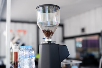 coffee grinder machine. modern coffee shop interior.