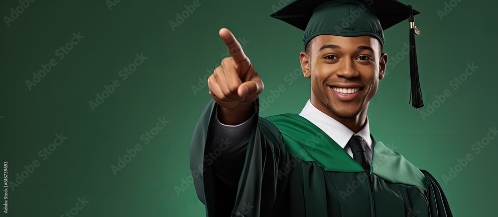 Poster A smiling graduate dressed in a master s gown and square cap points upward at an advertisement in a green isolated background Perfect for a copy space image 148 characters