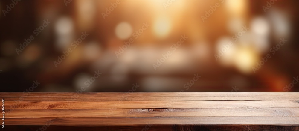 Poster In a room with blurred background there is a wood table top that offers empty copy space for various purposes