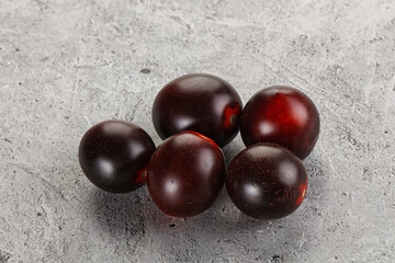 Raw ripe black kumato tomato