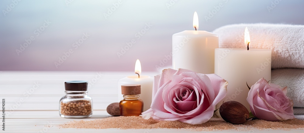 Poster copy space image of a stunning spa arrangement consisting of essential oil sea salt and rose placed 