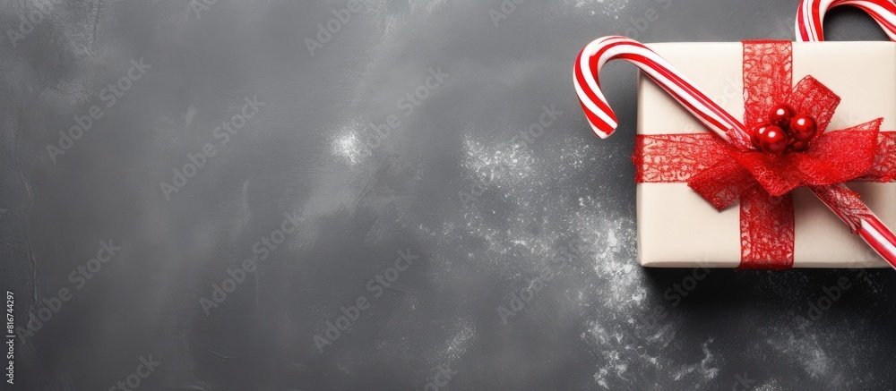 Leinwandbilder top view of a christmas decoration featuring a gift box and candy canes ample copy space is availabl