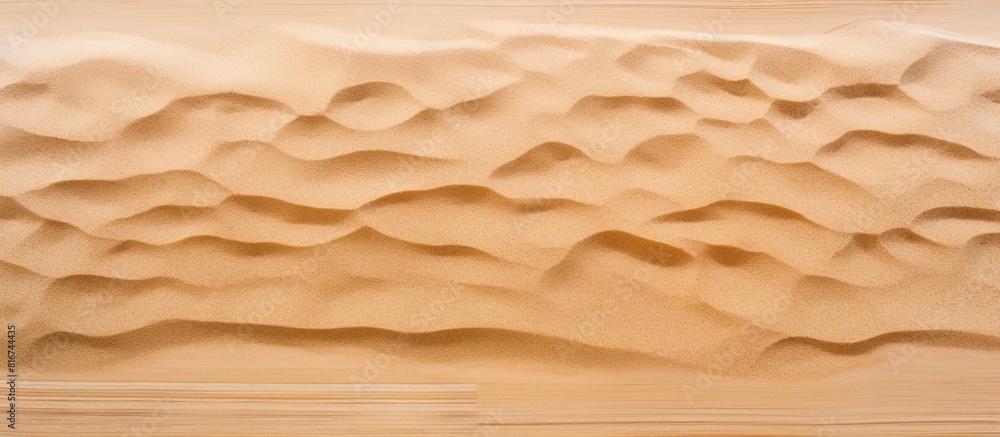 Aufkleber Top view of a sandy beach featuring a textured sand surface that serves as an ideal background for a copy space image