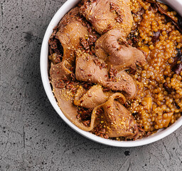 Hearty lentil stew with sliced meat