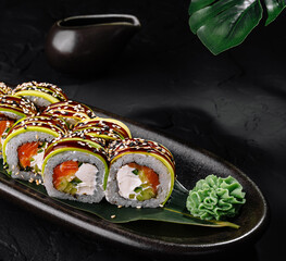 Elegant sushi platter on dark background