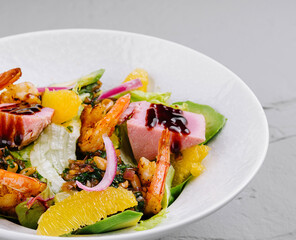 Fresh seafood salad with citrus fruits