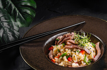 Delectable asian beef fried rice in elegant presentation