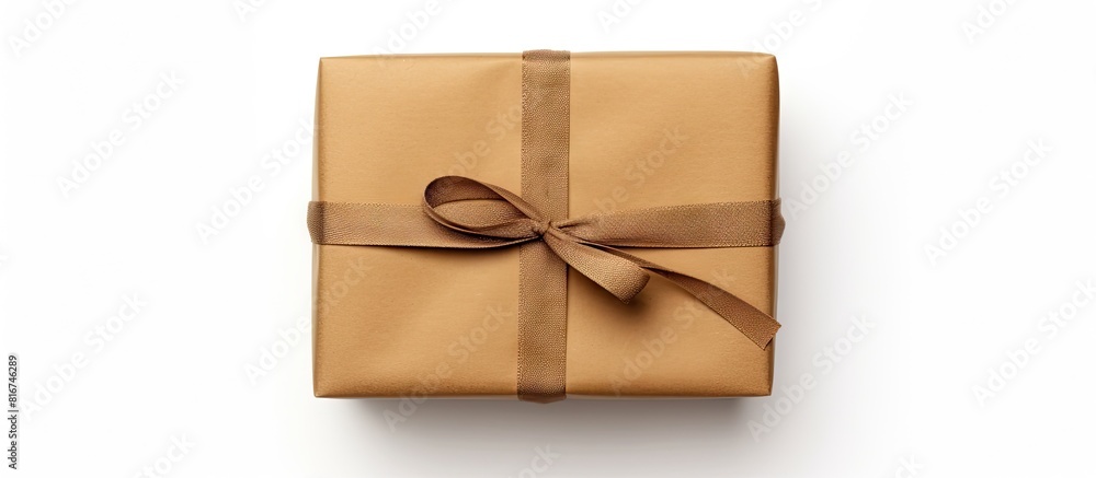 Aufkleber top view of a gift box wrapped in brown recycled paper and tied with a sack rope isolated on a white