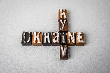 UKRAINE KYIV. Alphabet blocks, crossword puzzle on gray textured background