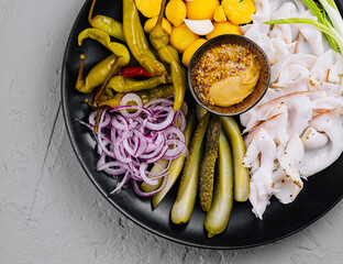 Gourmet cold cut or lard platter with pickles and mustard