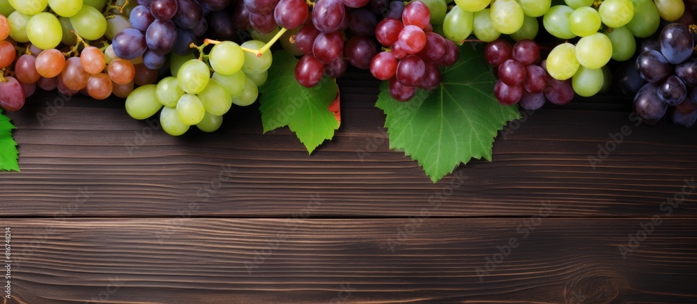 Aufkleber top view of a variety of fresh ripe and juicy grapes on a table with ample space available for text 