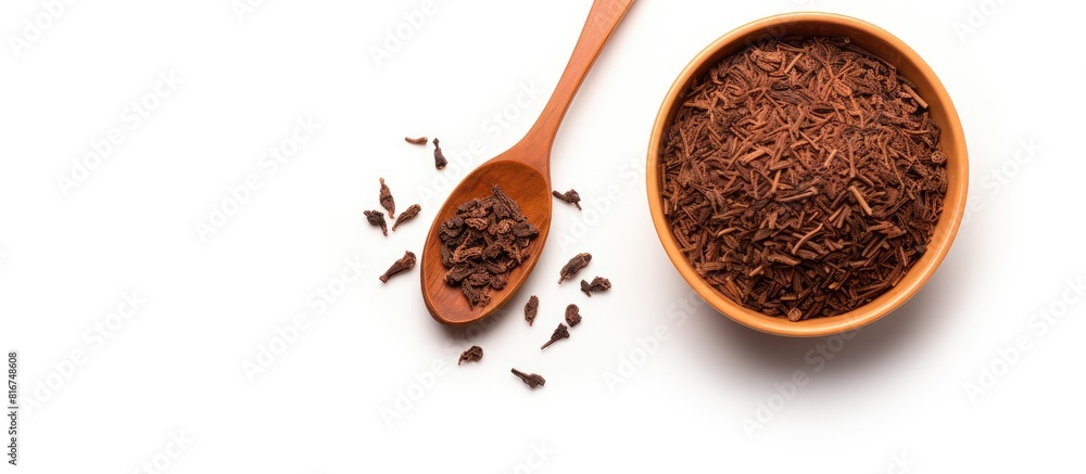 Poster top view of a bowl and scoop filled with dry tea leaves placed on a white background the image creat
