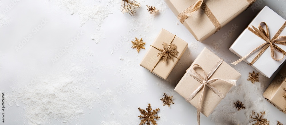 Poster a top down view of eco friendly christmas gift boxes made of decorated craft paper placed on a white