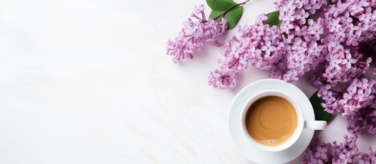 Obraz na płótnie Canvas A minimal concept for a wedding or Valentine s Day with a copy space image of a morning breakfast featuring a coffee cup and lilac flowers on a white background