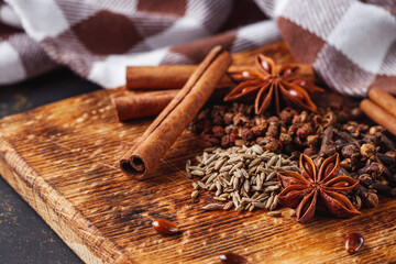 aromatic Chinese five spices on a dark rustic background