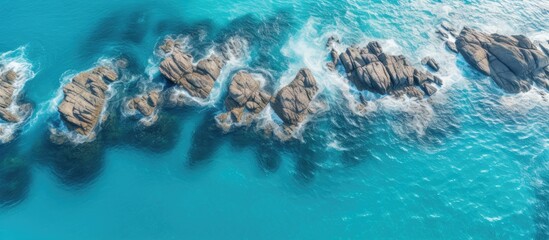 Aerial view of the coastline The azure turquoise sea borders on a stone coast Copy space