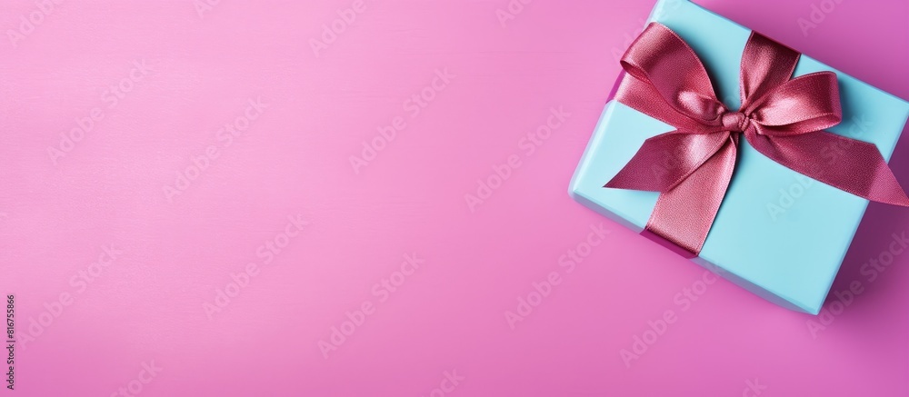 Poster Gift box with ribbon and bow on color background and space for text Top view. copy space available