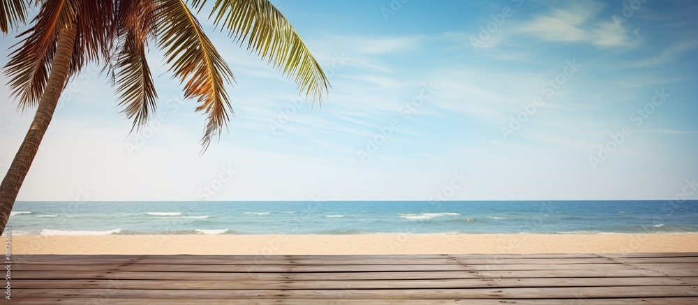 Poster summer beach scene with a palm tree and a wooden platform providing an inviting copy space image
