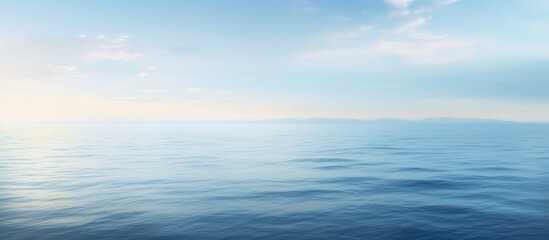 Obraz premium A serene abstract view of the ocean s tranquil surface in the early morning offering ample copy space for creative use