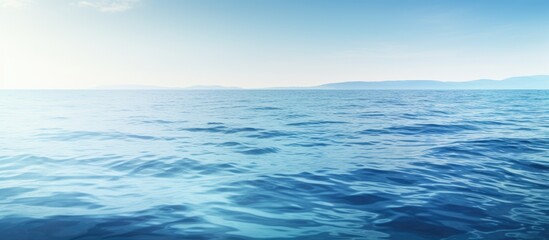 Obraz premium A serene abstract view of the ocean s tranquil surface in the early morning offering ample copy space for creative use