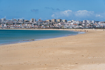 Meia Praia beach in Lagos, Algarve, Portugal. Crystal clear sea water. Sunny day.
