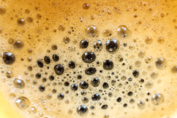 Coffee foam with bubbles as a background. Top view.