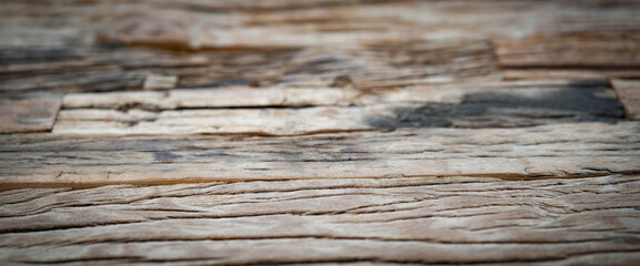 Weathered old wooden texture. Shabby bright gray wooden surface with inclusions and cracks....