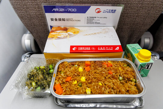 In-flight meal on board COMAC ARJ21-700 airplane of OTT Airlines Pudong airport in Shanghai, China