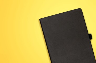 Black leather office notebook on the desk