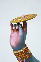 The legendary weapon of Vishnu is the Sudarshana Chakra on the finger.