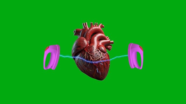 On a green background, a heart receives an electric shock from a defibrillator