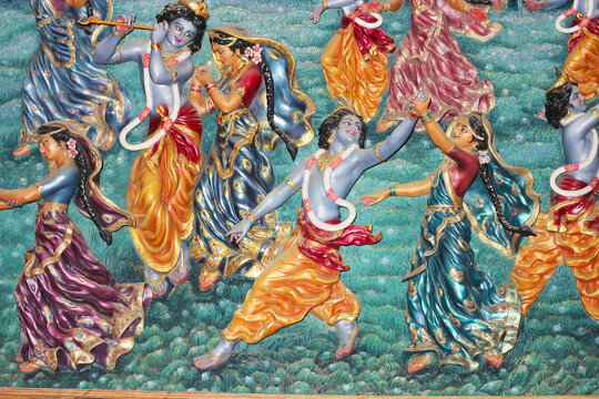 Bas-relief on the wall of the temple. Lord Krishna dances with the Gopis.