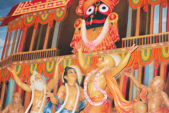 Lord Caitanya dances in ecstasy in front of Jagannath's chariot. Bas-relief in the temple, Mayapur, India, March 10, 2024.