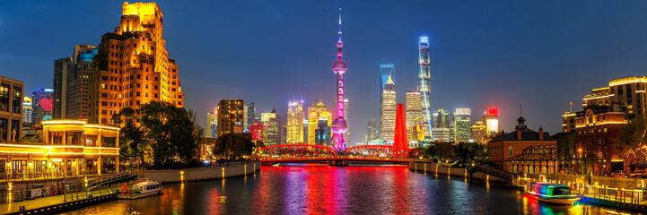 Shanghai skyline at Bund with Oriental Pearl Tower panorama downtown at night in China
