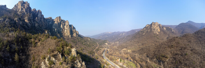 Panorama Armenia. Nature Dilijan region. Mountains in national park road passes at foot of mountain. Rocky landscape of Armenia. Panorama of Dilijan national park. Armenia landscape view from drone
