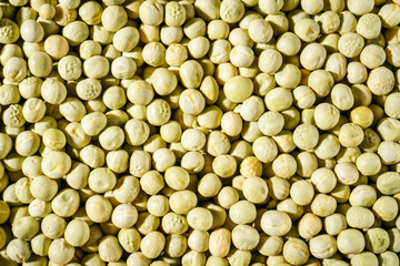 Background of a green peas grains close up. Food pattern.