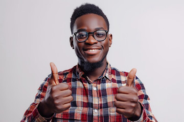 Image of a happy black male in casual clothes giving thumbs up on white studio background