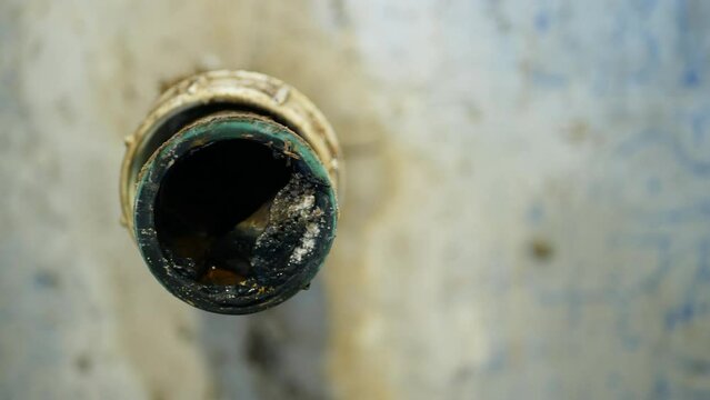 Sewer pipe wash-basin cleaning sink sewage kitchen blockage drain cleaning and septic cesspool pumping siphon into wash leak. The sump flowing contains pollution sludge water black wastewater