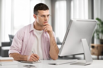 adult male worker work on computer