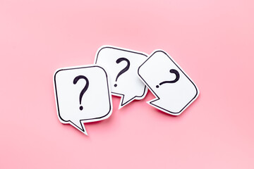 Question marks on paper speech bubbles. FAQ concept or search information concept