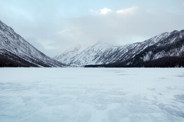 Snow-covered winter mountain lake, Russia, Siberia, Altai mountains.