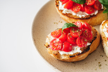 delicious Italian bruschetta with tomatoes on a white background