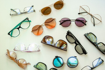 Flat lay of eyeglasses with different lenses, top view. Eyes healthcare concept