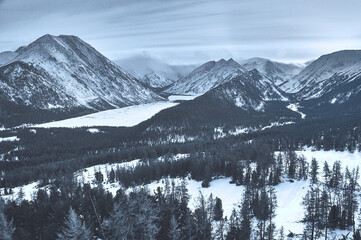 Snow-covered winter mountain lake, Russia, Siberia, Altai mountains.