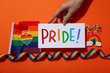 LGBT parade concept, symbols on orange background.