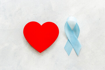 Fototapeta premium Blue ribbon with heart for world colon cancer day